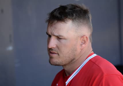 Mar 21, 2021; Peoria, Arizona, USA; Los Angeles Angels center fielder Mike Trout (27) looks on against the San Diego Padres during the fifth inning of a spring training game at Peoria Sports Complex. Mandatory Credit: Joe Camporeale-USA TODAY Sports