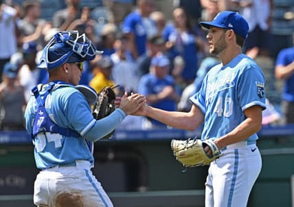 Jul 2, 2023; Kansas City, Missouri, USA;  Kansas City Royals relief pitcher Collin Snider (40) shakes hands with Kansas City Royals catcher Freddy Fermin (34) after defeating the Los Angeles Dodgers at Kauffman Stadium. Mandatory Credit: Peter Aiken-USA TODAY Sports