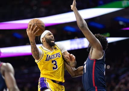 Nov 27, 2023; Philadelphia, Pennsylvania, USA; Los Angeles Lakers forward Anthony Davis (3) drives for a shot against Philadelphia 76ers center Joel Embiid (21) during the second quarter at Wells Fargo Center. Mandatory Credit: Bill Streicher-USA TODAY Sports