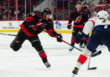Feb 22, 2024; Raleigh, North Carolina, USA; Carolina Hurricanes center Sebastian Aho (20) takes a shot against the Florida Panthers during the third period at PNC Arena. Mandatory Credit: James Guillory-USA TODAY Sports