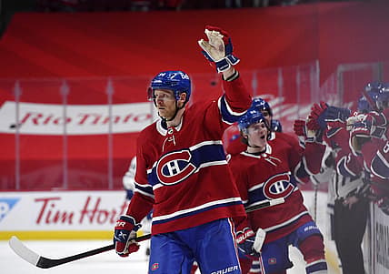 May 29, 2021; Montreal, Quebec, CAN; Montreal Canadiens forward Corey Perry (94) reacts with teammates including Cole Caufield (22) after scoring a goal against the Toronto Maple Leafs during the third period in game six of the first round of the 2021 Stanley Cup Playoffs at the Bell Centre. Mandatory Credit: Eric Bolte-USA TODAY Sports