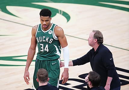 Jul 11, 2021; Milwaukee, Wisconsin, USA; Milwaukee Bucks forward Giannis Antetokounmpo (34) with head coach Mike Budenholzer against the Phoenix Suns during game three of the 2021 NBA Finals at Fiserv Forum. Mandatory Credit: Mark J. Rebilas-USA TODAY Sports