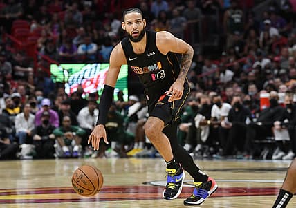 Dec 8, 2021; Miami, Florida, USA; Miami Heat forward Caleb Martin (16) brings the ball up the court against the Milwaukee Bucks in the second half at FTX Arena. Mandatory Credit: Jim Rassol-USA TODAY Sports