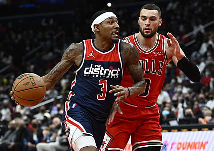 Jan 1, 2022; Washington, District of Columbia, USA; Washington Wizards guard Bradley Beal (3) dribbles as Chicago Bulls guard Zach LaVine (8) defends during the first half at Capital One Arena. Mandatory Credit: Brad Mills-USA TODAY Sports