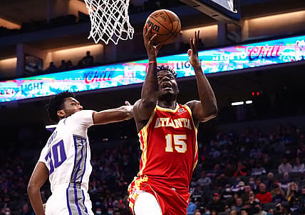 Jan 5, 2022; Sacramento, California, USA; Atlanta Hawks center Clint Capela (15) goes up for a shot against Sacramento Kings center Damian Jones (30) during the second quarter at Golden 1 Center. Mandatory Credit: Kelley L Cox-USA TODAY Sports