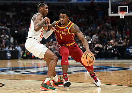 Mar 25, 2022; Chicago, IL, USA; Iowa State Cyclones guard Izaiah Brockington (1) drives against Miami Hurricanes guard Kameron McGusty (23) during the second half in the semifinals of the Midwest regional of the men's college basketball NCAA Tournament at United Center. Mandatory Credit: Jamie Sabau-USA TODAY Sports