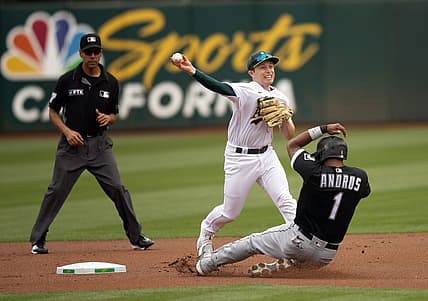 Sep 10, 2022; Oakland, California, USA; Oakland Athletics shortstop Nick Allen (2) throws over Chicago White Sox shortstop Elvis Andrus (1) to complete a double play during the first inning at RingCentral Coliseum. Yoan Moncada was out at first base. Umpire is Gabe Morales. Mandatory Credit: D. Ross Cameron-USA TODAY Sports