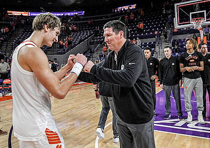 Clemson forward Hunter Tyson (5) and Clemson Head Coach Brad Brownell celebrate after the 101-94 two overtime win over Penn State University at Littlejohn Coliseum Tuesday, November 29, 2022.

Clemson Basketball Vs Penn State University Acc Big 10 Challenge