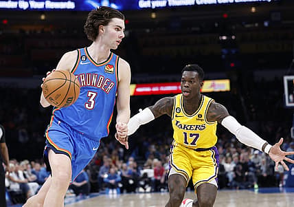 Mar 1, 2023; Oklahoma City, Oklahoma, USA; Oklahoma City Thunder guard Josh Giddey (3) dribbles the ball around Los Angeles Lakers guard Dennis Schroder (17) during the second quarter at Paycom Center. Mandatory Credit: Alonzo Adams-USA TODAY Sports