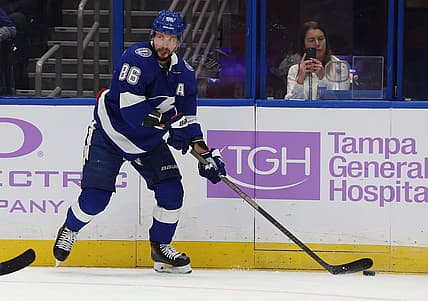 Nov 30, 2023; Tampa, Florida, USA; Tampa Bay Lightning right wing Nikita Kucherov (86) passes the puck against the Pittsburgh Penguins during the first period at Amalie Arena. Mandatory Credit: Kim Klement Neitzel-USA TODAY Sports
