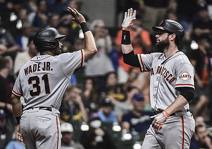 Aug 7, 2021; Milwaukee, Wisconsin, USA; San Francisco Giants first baseman Brandon Belt (9) is greeted by center fielder LaMonte Wade Jr (31) after hitting a two-run home run in the eleventh inning against the Milwaukee Brewers at American Family Field. Mandatory Credit: Benny Sieu-USA TODAY Sports