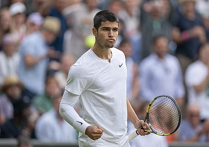 Jul 3, 2022; London, United Kingdom; Carlos Alcaraz (ESP) reacts to a point during his match against Jannik Sinner (ITA) on day seven at All England Lawn Tennis and Croquet Club. Mandatory Credit: Susan Mullane-USA TODAY Sports