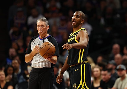 Nov 22, 2023; Phoenix, Arizona, USA; Golden State Warriors guard Chris Paul (3) alongside NBA referee Scott Foster against the Phoenix Suns in the first half at Footprint Center. Mandatory Credit: Mark J. Rebilas-USA TODAY Sports