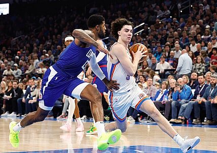 Dec 21, 2023; Oklahoma City, Oklahoma, USA; Oklahoma City Thunder guard Josh Giddey (3) drives past LA Clippers forward Paul George (13) during the second quarter at Paycom Center. Mandatory Credit: Alonzo Adams-USA TODAY Sports