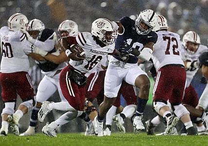 Oct 14, 2023; University Park, Pennsylvania, USA; Penn State Nittany Lions defensive end Jameial Lyons (19) pressures Massachusetts Minutemen quarterback Ahmad Haston (16) during the fourth quarter at Beaver Stadium. Penn State defeated Massachusetts 63-0. Mandatory Credit: Matthew O'Haren-USA TODAY Sports