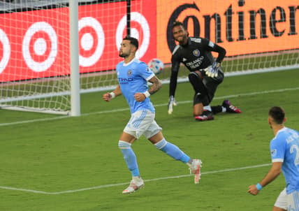 May 8, 2021; Orlando, Florida, USA; New York City midfielder Valentin Castellanos (11) celebrates after scoring a goal on a penalty kick past Orlando City goalkeeper Pedro Gallese (1) at Orlando City Stadium. Mandatory Credit: Matt Stamey-USA TODAY Sports