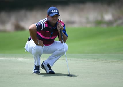Aug 5, 2021; Memphis, Tennessee, USA; Patrick Reed lines up a putt on the 13th hole during the first round of the WGC FedEx St. Jude Invitational golf tournament at TPC Southwind. Mandatory Credit: Christopher Hanewinckel-USA TODAY Sports