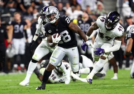 Sep 13, 2021; Paradise, Nevada, USA; Las Vegas Raiders running back Josh Jacobs (28) runs the ball against the Baltimore Ravens during the second half at Allegiant Stadium. Mandatory Credit: Mark J. Rebilas-USA TODAY Sports