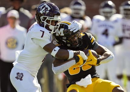 Oct 16, 2021; Columbia, Missouri, USA; Missouri Tigers wide receiver Tauskie Dove (86) is tackled by Texas A&M Aggies defensive back Tyreek Chappell (7) during the first half at Faurot Field at Memorial Stadium. Mandatory Credit: Jay Biggerstaff-USA TODAY Sports