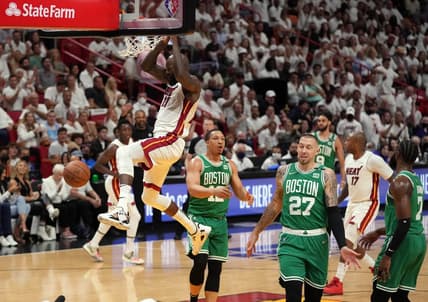 May 17, 2022; Miami, Florida, USA; Miami Heat center Dewayne Dedmon (21) dunks against the Boston Celtics during the first half of game one of the 2022 eastern conference finals at FTX Arena. Mandatory Credit: Jasen Vinlove-USA TODAY Sports