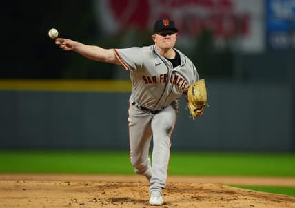 Sep 21, 2022; Denver, Colorado, USA;  San Francisco Giants starting pitcher Logan Webb (62) pitches in the first inning against the Colorado Rockies at Coors Field. Mandatory Credit: Ron Chenoy-USA TODAY Sports