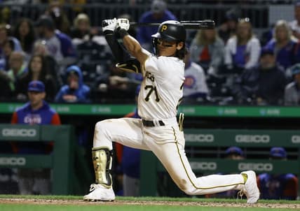 Sep 23, 2022; Pittsburgh, Pennsylvania, USA; Pittsburgh Pirates second baseman Ji-hwan Bae (71) hits a single against the Chicago Cubs during the ninth inning at PNC Park. It was the first MLB hit by Bae. Mandatory Credit: Charles LeClaire-USA TODAY Sports