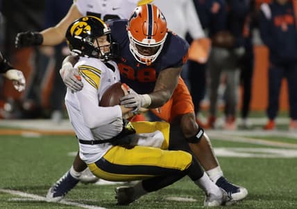 Oct 8, 2022; Champaign, Illinois, USA;  Illinois Fighting Illini defensive lineman Keith Randolph Jr. (88) sacks Iowa Hawkeyes quarterback Spencer Petras (7) during the first half at Memorial Stadium. Mandatory Credit: Ron Johnson-USA TODAY Sports