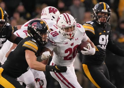 Iowa defensive back Cooper DeJean, left, tackles Wisconsin running back Isaac Guerendo in the second quarter during a NCAA college football game in Iowa City on Saturday, Nov. 12, 2022.

Iowavswisconsin 20221112 Bh