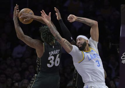 Dec 13, 2022; Los Angeles, California, USA;  Boston Celtics guard Marcus Smart (36) and Los Angeles Lakers forward Anthony Davis (3) reach for a rebound in the first half at Crypto.com Arena. Mandatory Credit: Jayne Kamin-Oncea-USA TODAY Sports