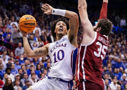 Jan 10, 2023; Lawrence, Kansas, USA; Kansas Jayhawks forward Jalen Wilson (10) shoots against Oklahoma Sooners forward Tanner Groves (35) during the second half at Allen Fieldhouse. Mandatory Credit: Jay Biggerstaff-USA TODAY Sports