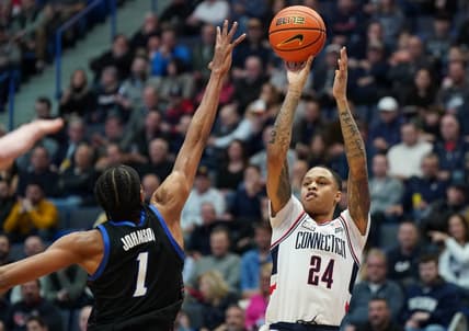 Mar 1, 2023; Hartford, Connecticut, USA; UConn Huskies guard Jordan Hawkins (24) shoots against DePaul Blue Demons forward Javan Johnson (1) in the first half at XL Center. Mandatory Credit: David Butler II-USA TODAY Sports