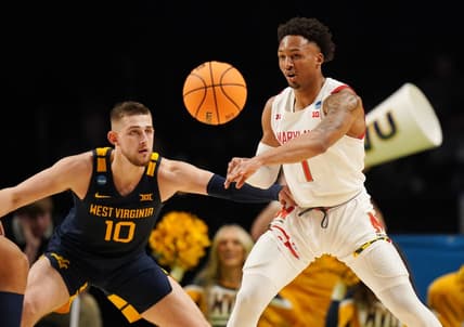 Mar 16, 2023; Birmingham, AL, USA; Maryland Terrapins guard Jahmir Young (1) passes the ball away from West Virginia Mountaineers guard Erik Stevenson (10) during the first half in the first round of the 2023 NCAA Tournament at Legacy Arena. Mandatory Credit: Marvin Gentry-USA TODAY Sports