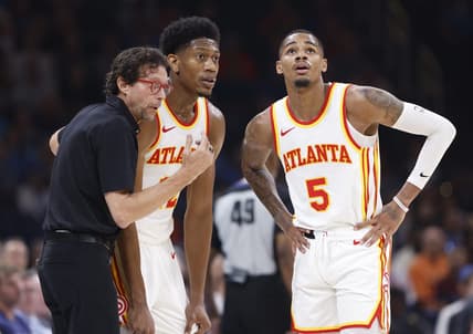 Nov 6, 2023; Oklahoma City, Oklahoma, USA; Atlanta Hawks head coach Quin Snyder talks with Atlanta Hawks forward De'Andre Hunter (12) and guard Dejounte Murray (5) during a break in play against the Oklahoma City Thunder in the second quarter at Paycom Center. Mandatory Credit: Alonzo Adams-USA TODAY Sports