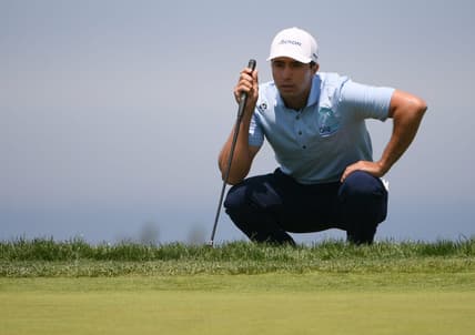 Jun 17, 2021; San Diego, California, USA; Alvaro Ortiz lines up a putt on the 14th green during the first round of the U.S. Open golf tournament at Torrey Pines Golf Course. Mandatory Credit: Orlando Ramirez-USA TODAY Sports