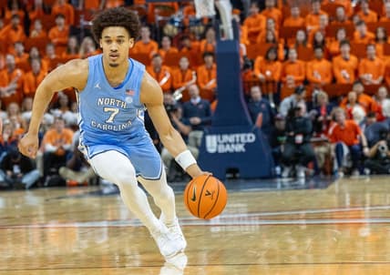 Feb 24, 2024, in Charlottesville, Virginia, USA; North Carolina Tar Heels guard Seth Trimble (7) dribbles against the Virginia Cavaliers at John Paul Jones Arena. Mandatory Credit: Hannah Pajewski-USA TODAY Sports