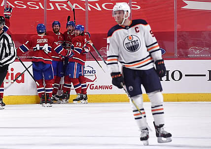 Apr 5, 2021; Montreal, Quebec, CAN; Montreal Canadiens forward Eric Staal (21) reacts with teammates including defenseman Jeff Petry (26) and forward Tyler Toffoli (73) and forward Nick Suzuki (14) after scoring the winning goal against the Edmonton Oilers during the overtime period at the Bell Centre. Mandatory Credit: Eric Bolte-USA TODAY Sports