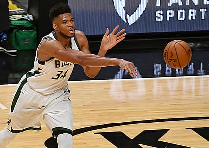 Dec 29, 2020; Miami, Florida, USA; Milwaukee Bucks forward Giannis Antetokounmpo (34) passes the ball during the second half against the Miami Heat at American Airlines Arena. Mandatory Credit: Jasen Vinlove-USA TODAY Sports