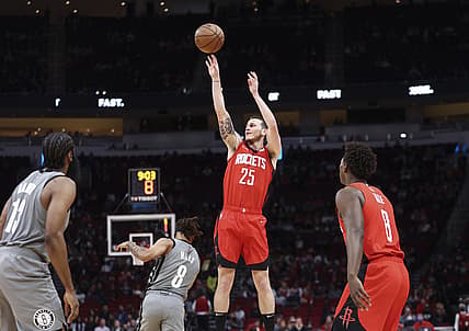 Dec 8, 2021; Houston, Texas, USA; Houston Rockets guard Garrison Mathews (25) shoots the ball during the first quarter against the Brooklyn Nets at Toyota Center. Mandatory Credit: Troy Taormina-USA TODAY Sports