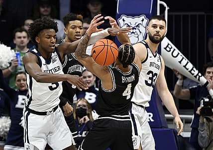 Feb 20, 2022; Indianapolis, Indiana, USA; Butler Bulldogs guard Chuck Harris (3) blocks a shot by Providence Friars guard Jared Bynum (4) during the first half at Hinkle Fieldhouse. Mandatory Credit: Marc Lebryk-USA TODAY Sports