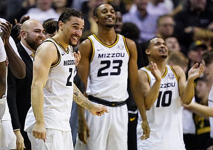 Dec 28, 2022; Columbia, Missouri, USA; Missouri Tigers guard Tre Gomillion (2) and forward Aidan Shaw (23) and guard Nick Honor (10) celebrate late in the second half against the Kentucky Wildcats at Mizzou Arena. Mandatory Credit: Jay Biggerstaff-USA TODAY Sports