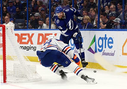 Nov 18, 2023; Tampa, Florida, USA; Tampa Bay Lightning defenseman Erik Cernak (81) passes the puck s Edmonton Oilers right wing Connor Brown (28) defends during the second period at Amalie Arena. Mandatory Credit: Kim Klement Neitzel-USA TODAY Sports