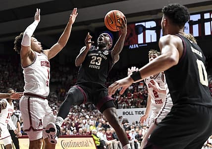 Feb 17, 2024; Tuscaloosa, Alabama, USA;  Texas A&M Aggies guard Tyrece Radford (23) shoots in the lane against Alabama Crimson Tide guard Mark Sears (1) during the first half at Coleman Coliseum. Mandatory Credit: Gary Cosby Jr.-USA TODAY Sports