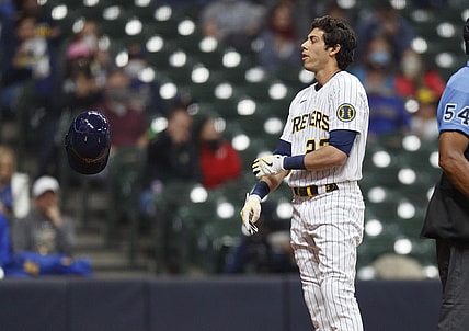 Apr 3, 2021; Milwaukee, Wisconsin, USA;  Milwaukee Brewers left fielder Christian Yelich (22) tosses his helmet after striking out against the Minnesota Twins during the fourth inning at American Family Field. Mandatory Credit: Jeff Hanisch-USA TODAY Sports