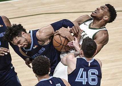Apr 17, 2021; Milwaukee, Wisconsin, USA; Milwaukee Bucks forward Giannis Antetokounmpo (34) and Memphis Grizzlies forward Dillon Brooks (24) battle for a rebound in the second quarter at Fiserv Forum. Mandatory Credit: Benny Sieu-USA TODAY Sports
