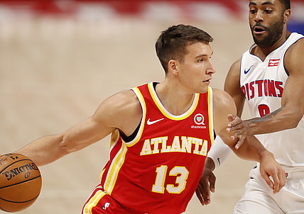 Apr 26, 2021; Detroit, Michigan, USA; Atlanta Hawks guard Bogdan Bogdanovic (13) drives to the basket against Detroit Pistons guard Wayne Ellington (8) during the first quarter at Little Caesars Arena. Mandatory Credit: Raj Mehta-USA TODAY Sports