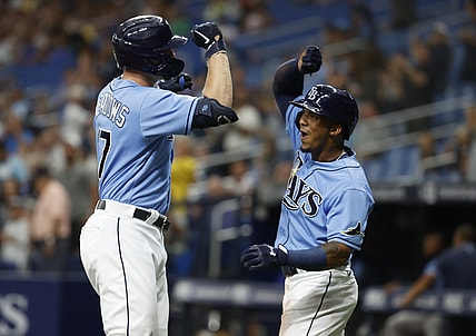 Jun 23, 2021; St. Petersburg, Florida, USA;  Tampa Bay Rays designated hitter Austin Meadows (17) is congratulated  by infielder Wander Franco (5) after he hits a two-run home run during the first inning against the Boston Red Sox at Tropicana Field. Mandatory Credit: Kim Klement-USA TODAY Sports