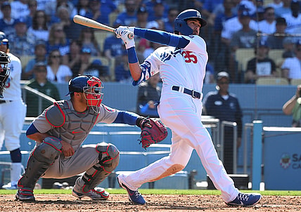 Jun 27, 2021; Los Angeles, California, USA;   Los Angeles Dodgers center fielder Cody Bellinger (35) hits a two run home run off of Chicago Cubs starting pitcher Adbert Alzolay (73) in the second inning of the game at Dodger Stadium. Mandatory Credit: Jayne Kamin-Oncea-USA TODAY Sports