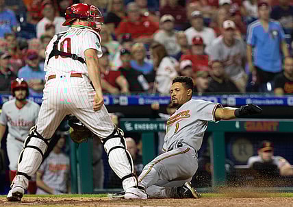 Sep 21, 2021; Philadelphia, Pennsylvania, USA; Baltimore Orioles shortstop Richie Martin (1) slides home safely past Philadelphia Phillies catcher J.T. Realmuto (10) during the fourth inning at Citizens Bank Park. Mandatory Credit: Bill Streicher-USA TODAY Sports