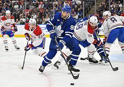Feb 18, 2023; Toronto, Ontario, CAN;   Toronto Maple Leafs forward Ryan O'Reilly (90) looks for a passing option against the Montreal Canadiens in the first period at Scotiabank Arena. Mandatory Credit: Dan Hamilton-USA TODAY Sports