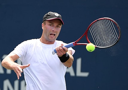 Aug 8, 2021; Toronto, Ontario, Canada; Liam Broady of Great Britain plays a shot against Tommy Paul of the United States during second round qualifying for the National Bank Open. Mandatory Credit: Dan Hamilton-USA TODAY Sports
